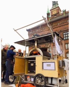 Selling pizzas in Copenhagen City Hall Square from his 400 kilo bike